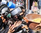 ‘Desperate, traumatised people’: Gaza faces wave of looting, theft and violence