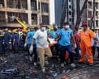 Air India disaster: rescue teams with sniffer dogs comb site of deadly plane crash