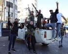 ‘Shot in the head, as if executed’: four days of violence end with hundreds dead in southern Syria