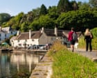 ‘Sipping a pint while trout splashed in the river on a perfect summer’s day’: readers’ favourite UK waterside pubs