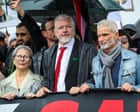 Julian Assange joins pro-Palestine march across Sydney Harbour Bridge before police stop rally citing safety fears