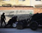 ‘They’re to put the brakes on cops’: Rio barricades turn favelas into fortresses