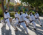 ‘It’s more than martial arts – we teach courage‘: the Afghan sisters honing karate skills in Iran