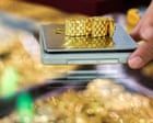 Gold hits record high in best year since 1979; JLR production shutdown extended by another week – business live